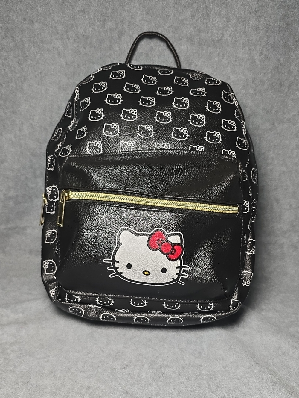Sanrio Hello Kitty Black Backpack with Red Bow and Gold Accent